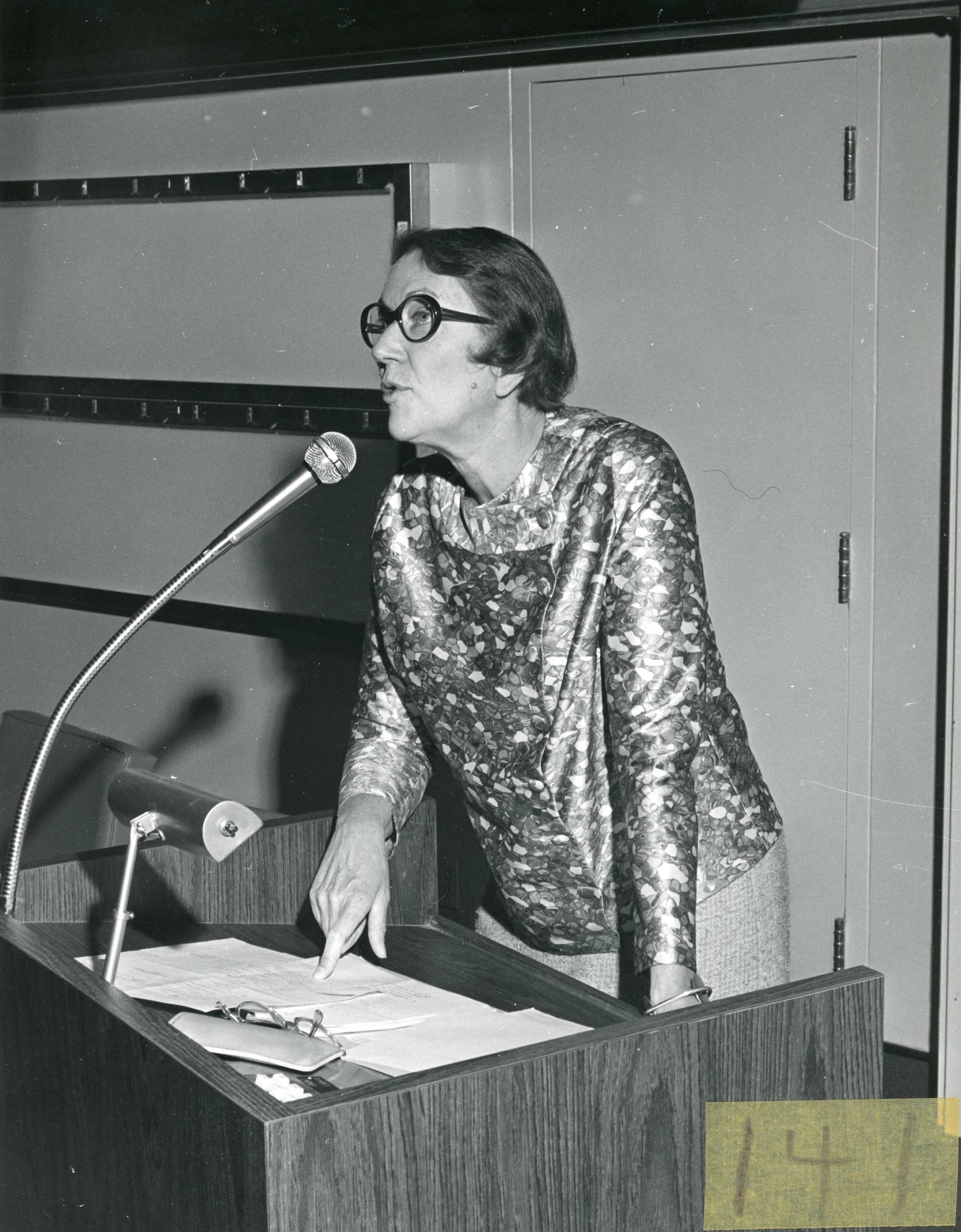Moyra Allen gives speech at a podium