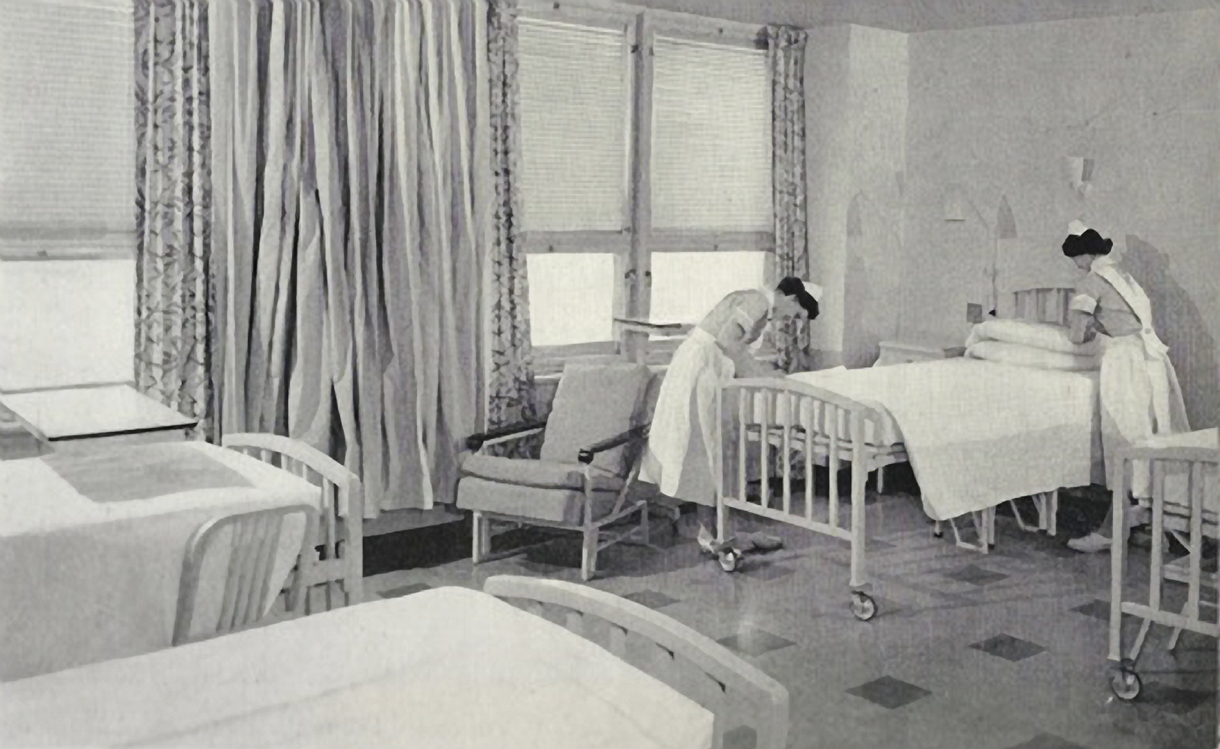 nurses make bed in a pristine ward at the new mgh